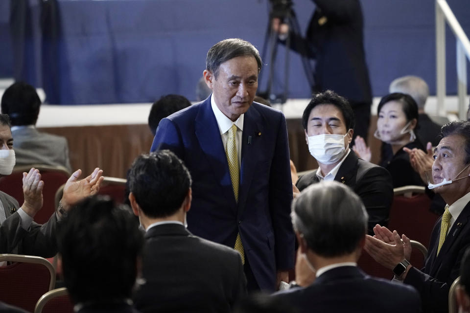 Japanese Chief Cabinet Secretary Yoshihide Suga acknowledges as he is elected as new head of Japan's ruling party at the Liberal Democratic Party's (LDP) leadership election Monday, Sept. 14, 2020, in Tokyo. The ruling LDP chooses its new leader in an internal vote to pick a successor to Prime Minister Shinzo Abe, who announced his intention to resign last month due to illness. (AP Photo/Eugene Hoshiko, Pool)