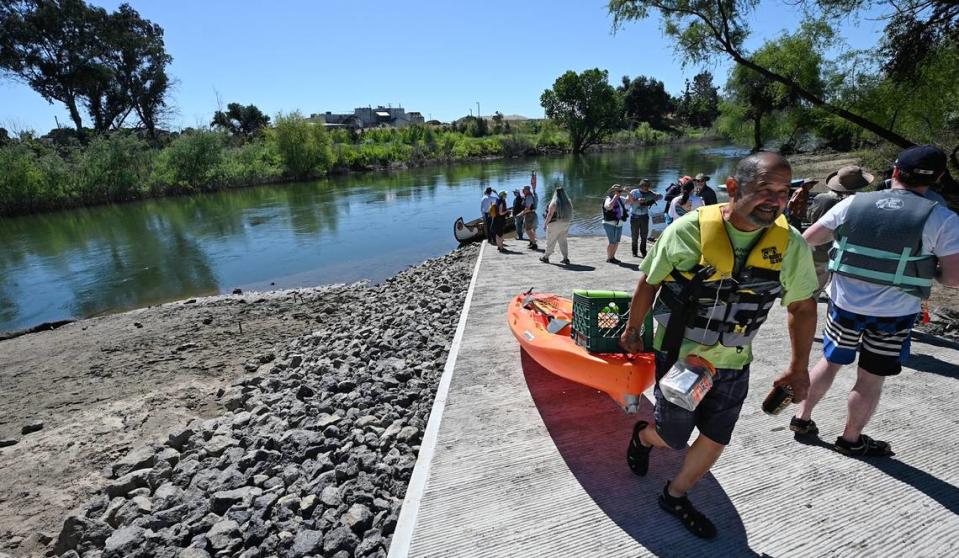 Art Fabela, right, boated with a group in kayaks and canoes from Gateway Park to the Neece Drive Boat Launch at Tuolumne River Regional Park in Modesto, Calif., Friday, May 10, 2024.