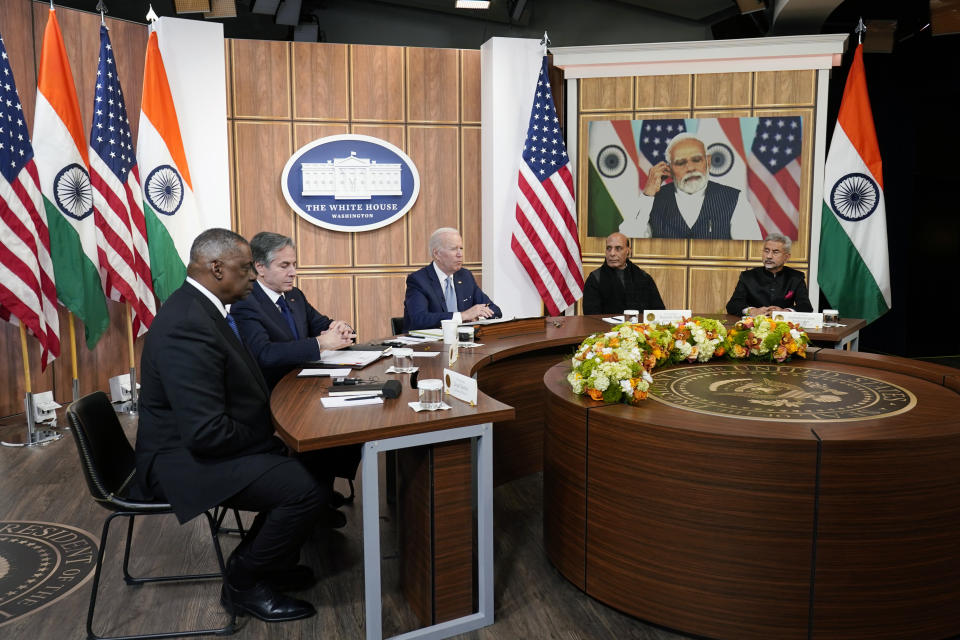 President Joe Biden meets virtually with Indian Prime Minister Narendra Modi in the South Court Auditorium on the White House campus in Washington, Monday, April 11, 2022. Secretary of Defense Lloyd Austin, left, and Secretary of State Antony Blinken, second left, and Indian Minister of Defense Rajnath Singh, second right, Minister of External Affairs Subrahmanyam Jaishankar is right. (AP Photo/Carolyn Kaster)