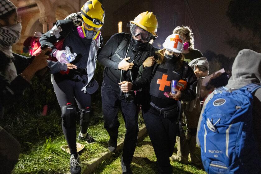 Los Angeles, CA - May 02: Demonstrators occupy a Pro-Palestinian encampment at UCLA as authorities breach and break up the encampment on Thursday, May 2, 2024 in Los Angeles, CA. (Jason Armond / Los Angeles Times)