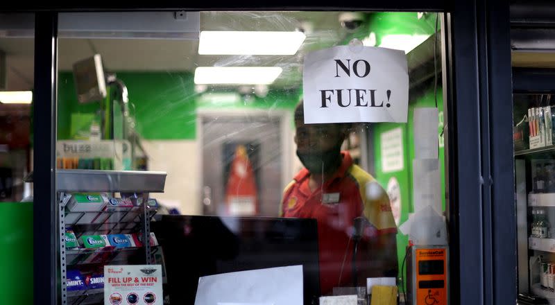 A sign shows customers that fuel has run out at a petrol station