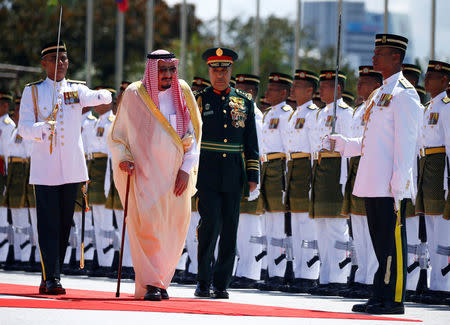 Saudi Arabia's King Salman inspects an honour guard at the Parliament House in Kuala Lumpur, Malaysia February 26, 2017. REUTERS/Edgar Su