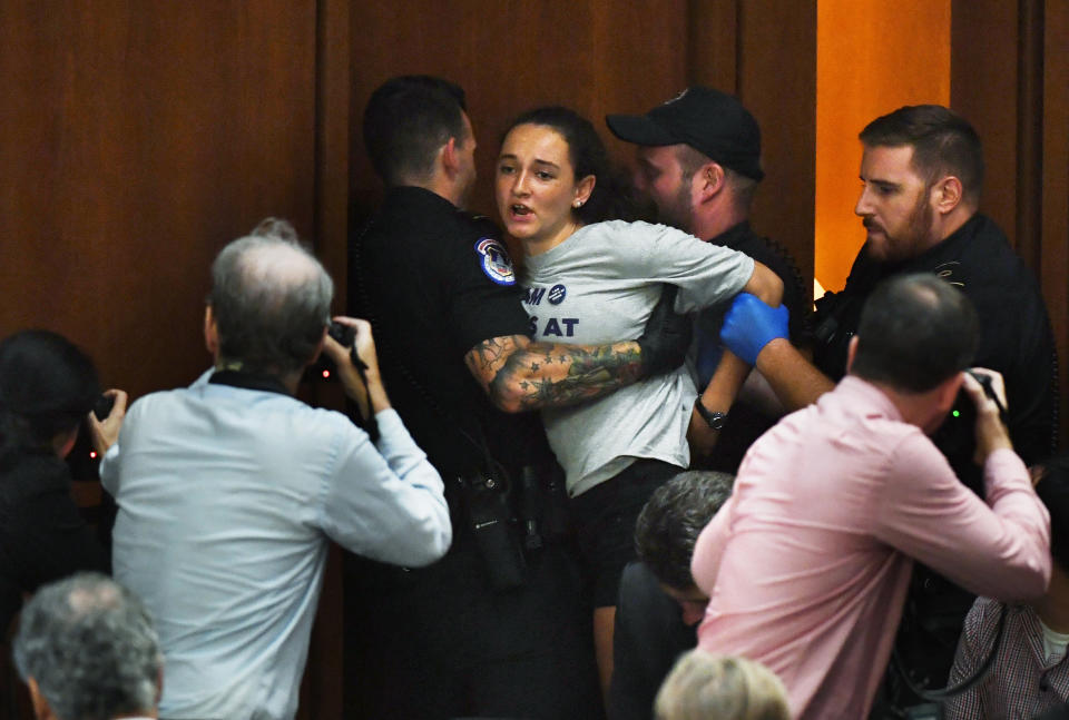 Margot Bloch being detained by police after she disrupted Brett Kavanaugh's Supreme Court confirmation hearing on Sept. 4, 2018. (Photo: The Washington Post via Getty Images)