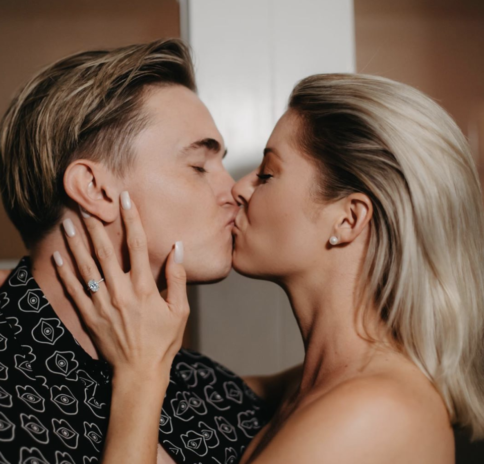 Jesse McCartney and his fiancé Katie Peterson share a kiss to celebrate their engagement