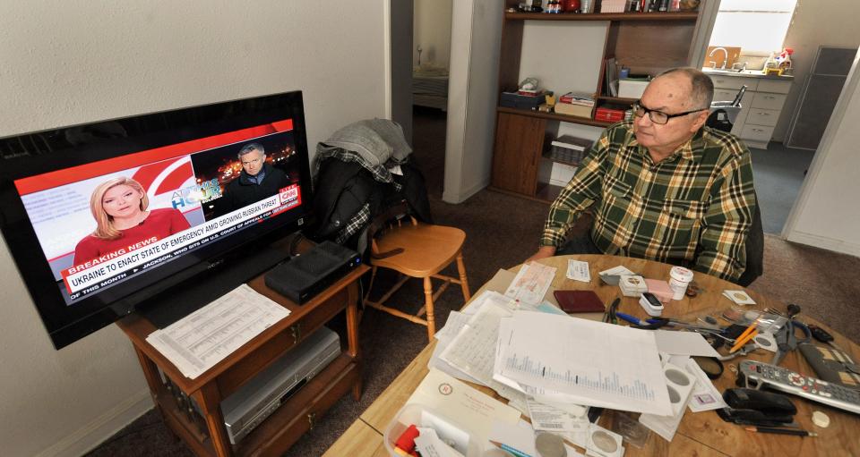 Vlad Brodsky, who moved to the U.S. from Ukraine in 1994, watches the news about Ukraine from his home in Springfield on Wednesday. [Thomas J. Turney/The State Journal-Register]