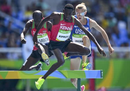 Conseslus Kipruto of Kenya competes ahead of Evan Jager (USA) of USA and Ezekiel Kemboi of Kenya. REUTERS/Dylan Martinez
