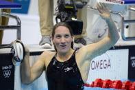 France's Camille Muffat celebrates after the women's 400m freestyle final swimming event at the London 2012 Olympic Games in London. Muffat won gold