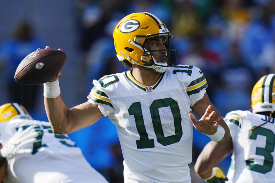 Green Bay Packers quarterback Jordan Love passes against the Carolina Panthers during the first half of an NFL football game Sunday, Dec. 24, 2023, in Charlotte, N.C. (AP Photo/Rusty Jones)