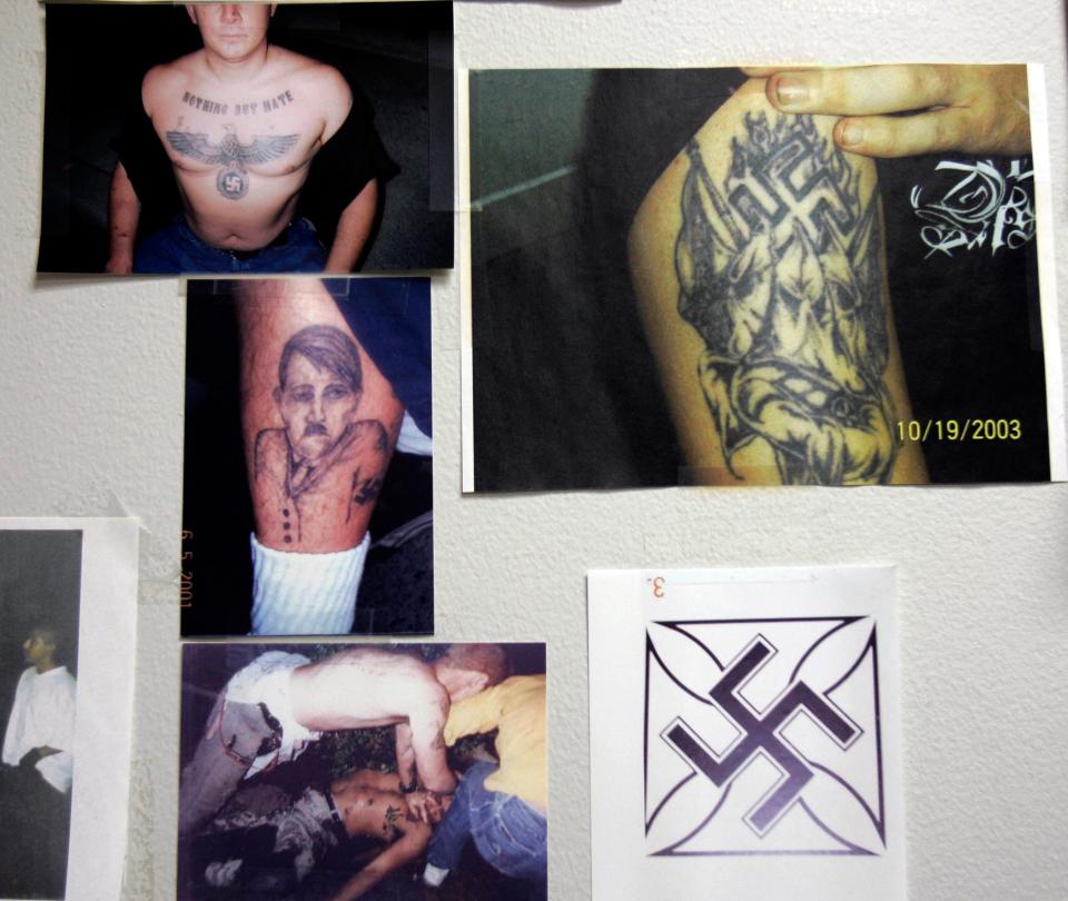 Photographs of neo-Nazi tattoos hang in the gang unit office at the police station in Buena Park, Calif., in 2007, which was very concerned about the white supremacist gang Public Enemy No. 1 at the time.