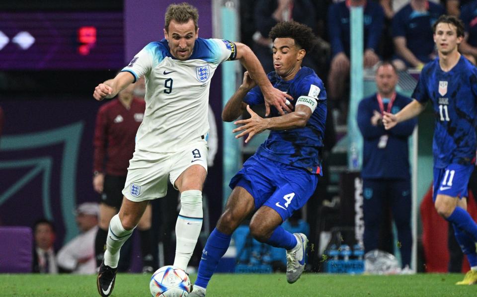 Harry Kane battles with Tyler Adams at the Qatar World Cup - Harry Kane's record-breaking England career in four stages - Getty Images/Lionel Hahn