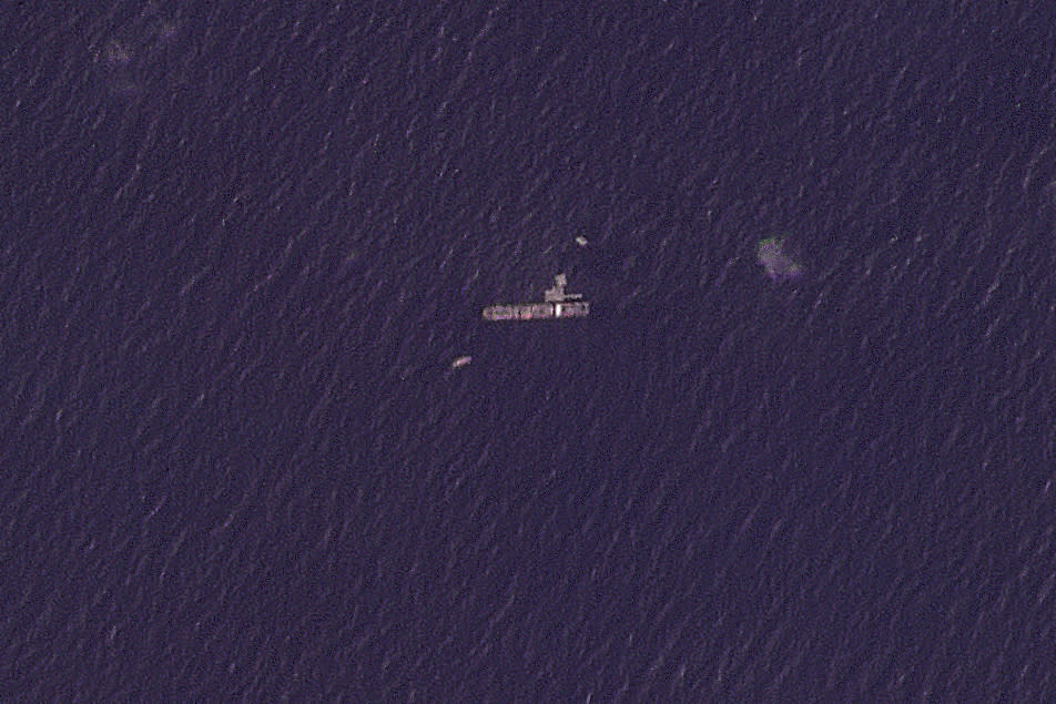 This satellite photo from Planet Labs PBC shows the USNS Roy P. Benavidez in the Mediterranean Sea off shore from the Gaza Strip on Sunday, April 28, 2024. A U.S. Navy ship involved in the American-led effort to bring more aid into the besieged Gaza Strip is off shore from the enclave, slowly building out a floating platform for the operation, satellite photos analyzed Monday, April 29, 2024, by The Associated Press show. (Planet Labs PBC via AP)