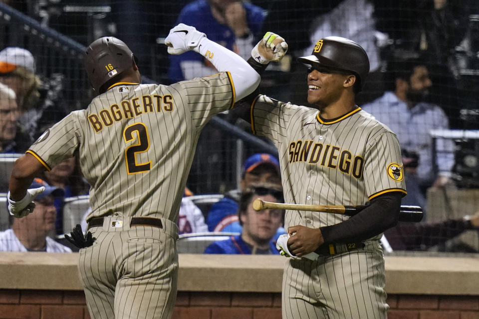 San Diego Padres' Juan Soto, right, celebrates with Xander Bogaerts after Bogaerts hit a two-run home run against the New York Mets during the ninth inning of a baseball game Tuesday, April 11, 2023, in New York. (AP Photo/Frank Franklin II)