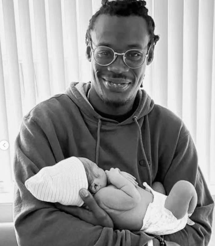 The author holding his baby