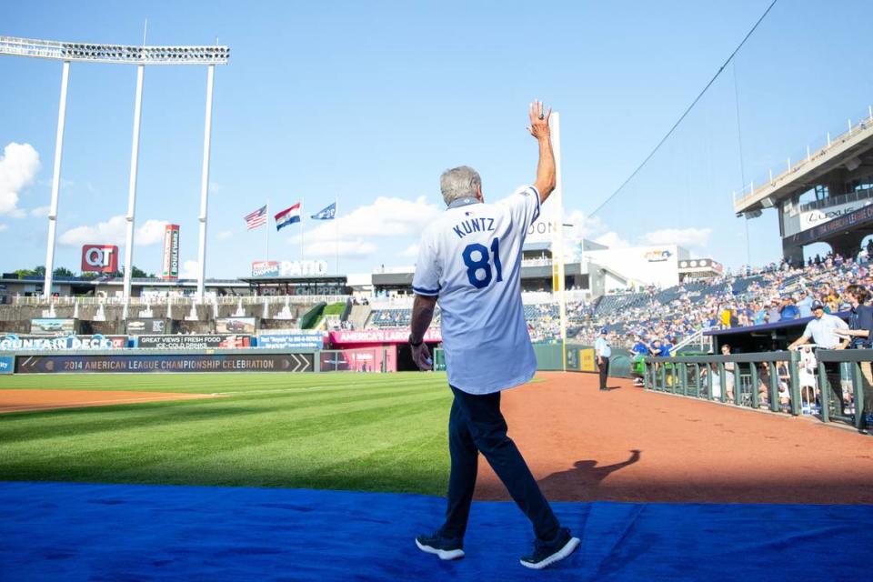 Former Kansas City Royals coach Rusty Kuntz waves to the crowd during a pre-game ceremony honoring the club’s 2014 American League champions at Kauffman Stadium on Friday, May 17, 2024.