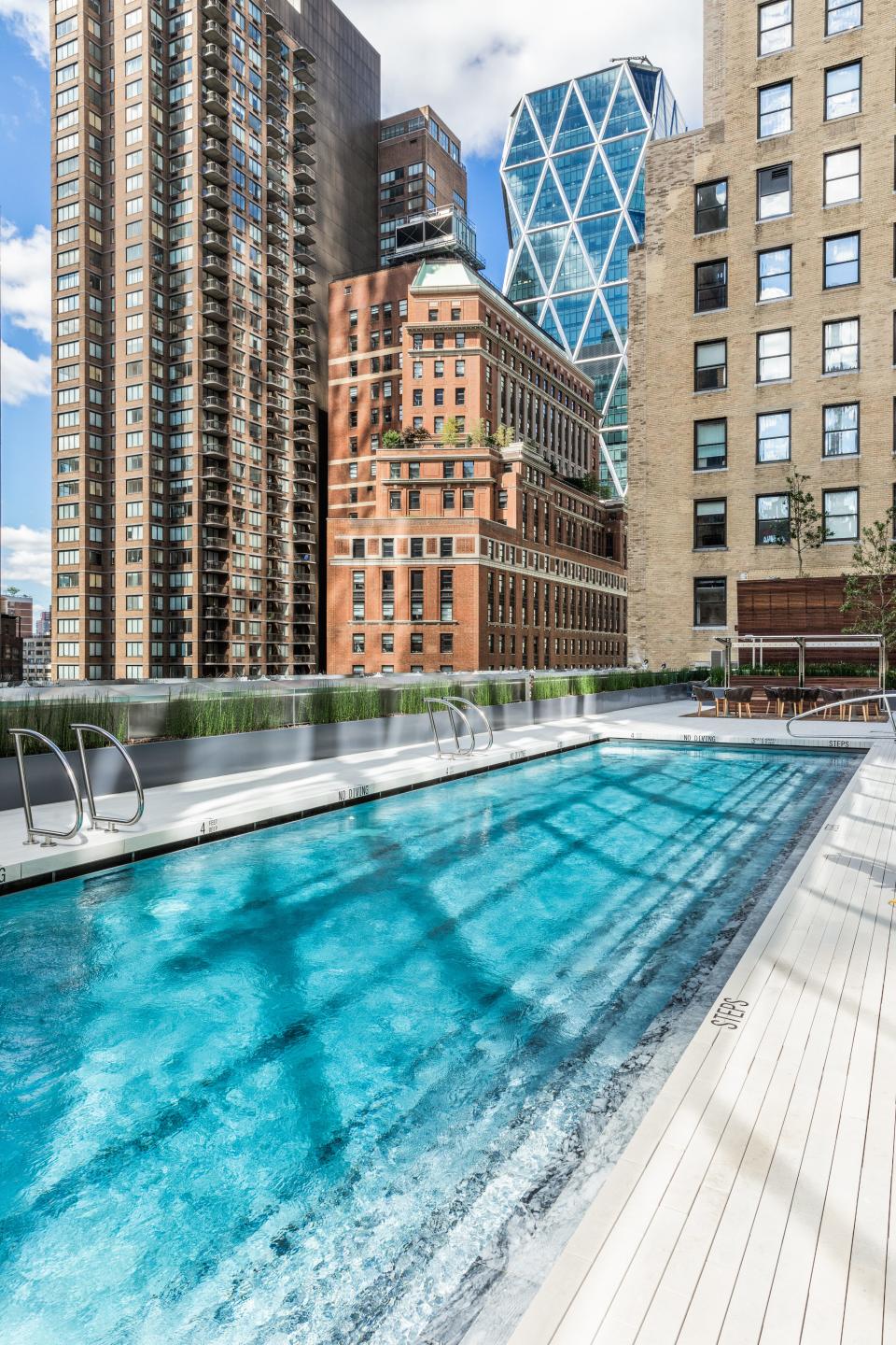 an outdoor pool on the 14th floor of luxury skyscraper Central Park Tower