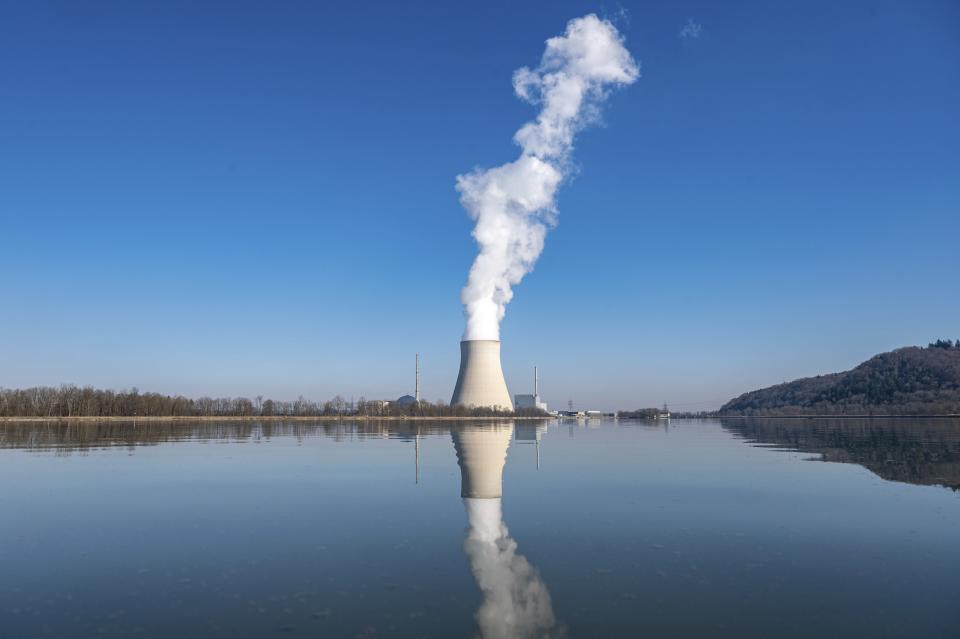 FILE - Water vapor rises from the nuclear power plant Isar II in Essenbach, Germany, March 3, 2022. Germany is shutting down this nuclear power plant and two others on Saturday, April, 2023, as part of an energy transition agreed by successive governments. (Armin Weigel/dpa via AP, File)