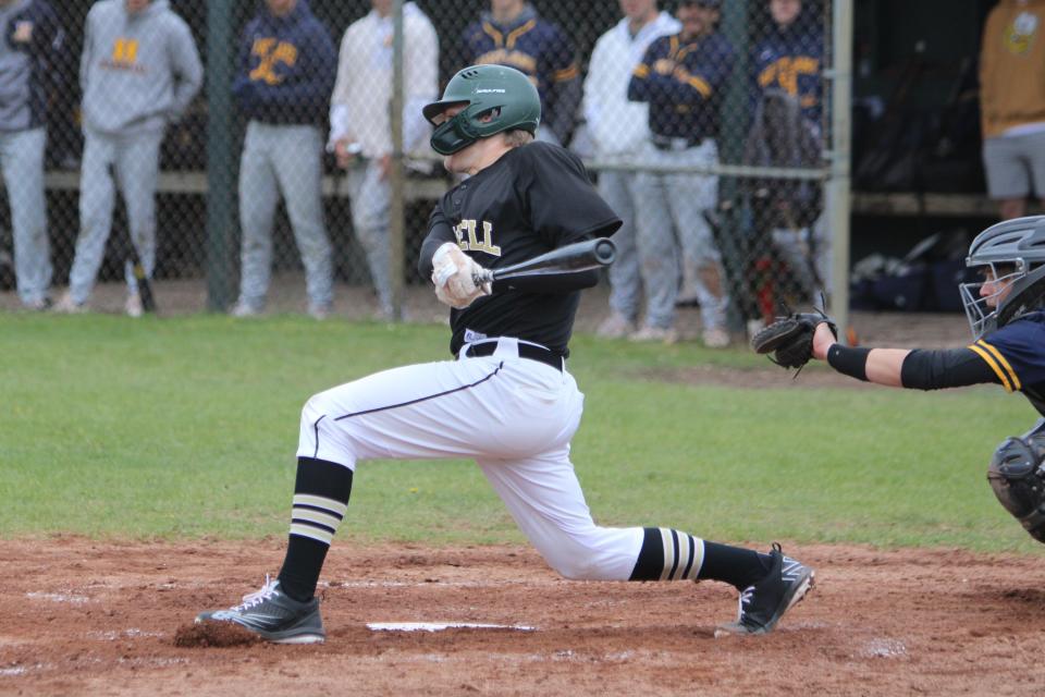 Howell's Curtis Dell hits the ball against Hartland on Wednesday, May 3, 2023.