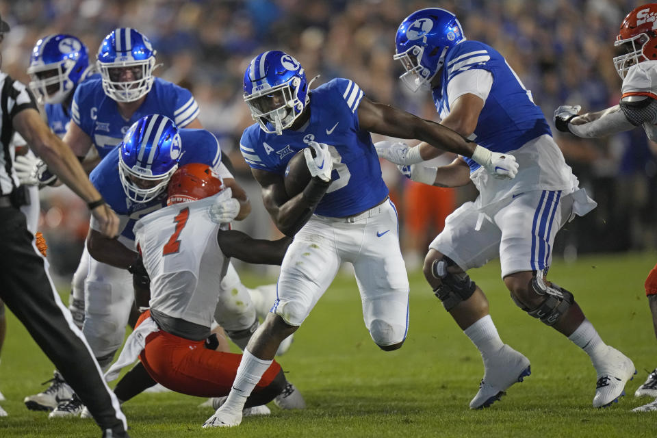 BYU running back Aidan Robbins (3) carries the ball against Sam Houston State during the first half of an NCAA college football game Saturday, Sept. 2, 2023, in Provo, Utah. (AP Photo/Rick Bowmer)