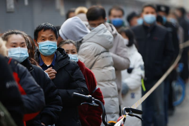 People line up to get their nucleic acid test following the outbreak of the coronavirus disease (COVID-19) in Beijing