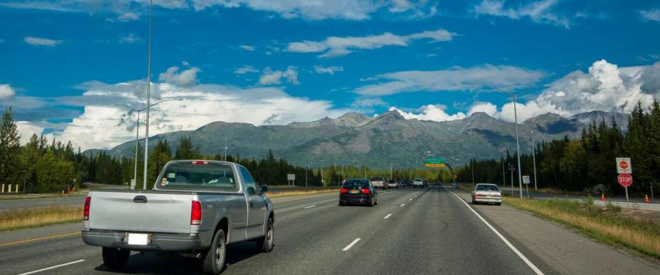 Traffic near Anchorage on Alaskan road in good weather with cars on freeway