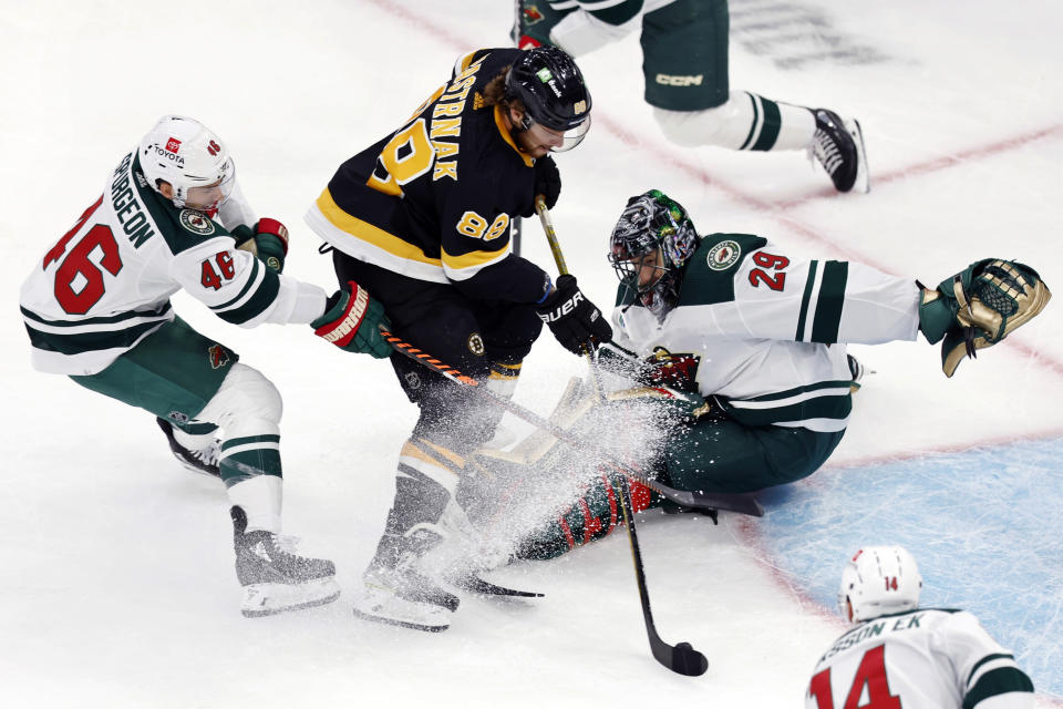 Boston Bruins' David Pastrnak (88) sets up to score past Minnesota Wild's Marc-Andre Fleury (29) during the first period of an NHL hockey game, Saturday, Oct. 22, 2022, in Boston. (AP Photo/Michael Dwyer)