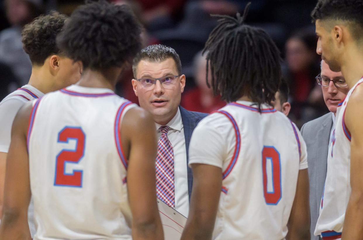 Bradley head coach Brian Wardle talks with his players as they try to rally against Cleveland State in the final minutes of their nonconference basketball game Friday, Dec. 15, 2023 at Carver Arena. The Braves fell to the Vikings 76-69.