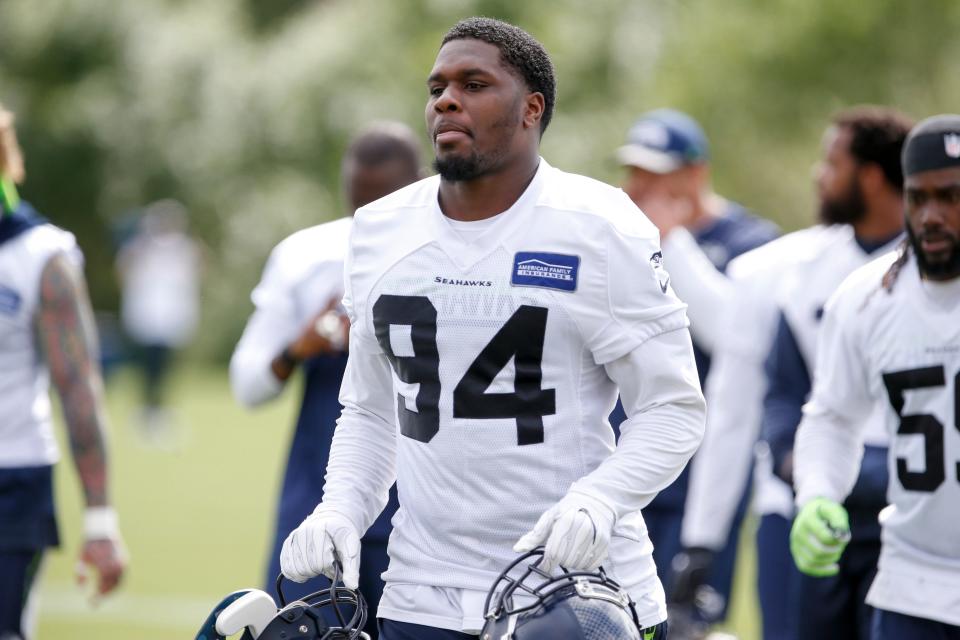 Jun 13, 2017; Renton, WA, USA; Seattle Seahawks defensive tackle Malik McDowell carries helmets back to the locker room following a minicamp practice at the Virginia Mason Athletic Center.