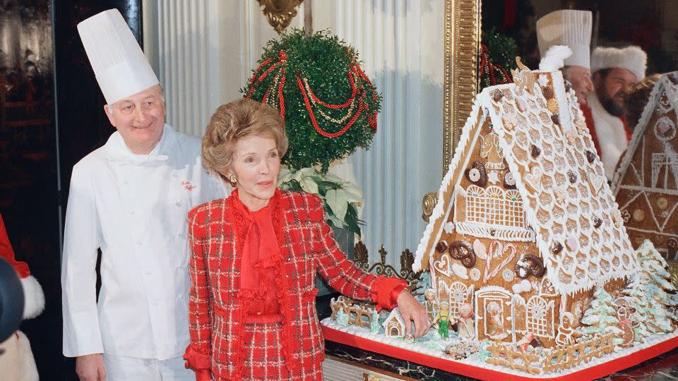 <strong>1987</strong>: Reagan (pictured with White House chef Hans Raffert) debuted the year's gingerbread house, which included a miniature version of her dog, Rex. - Barry Thumma/AP