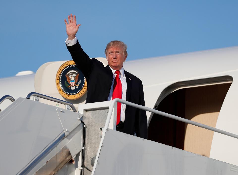 President Donald Trump boards Air Force One at Morristown