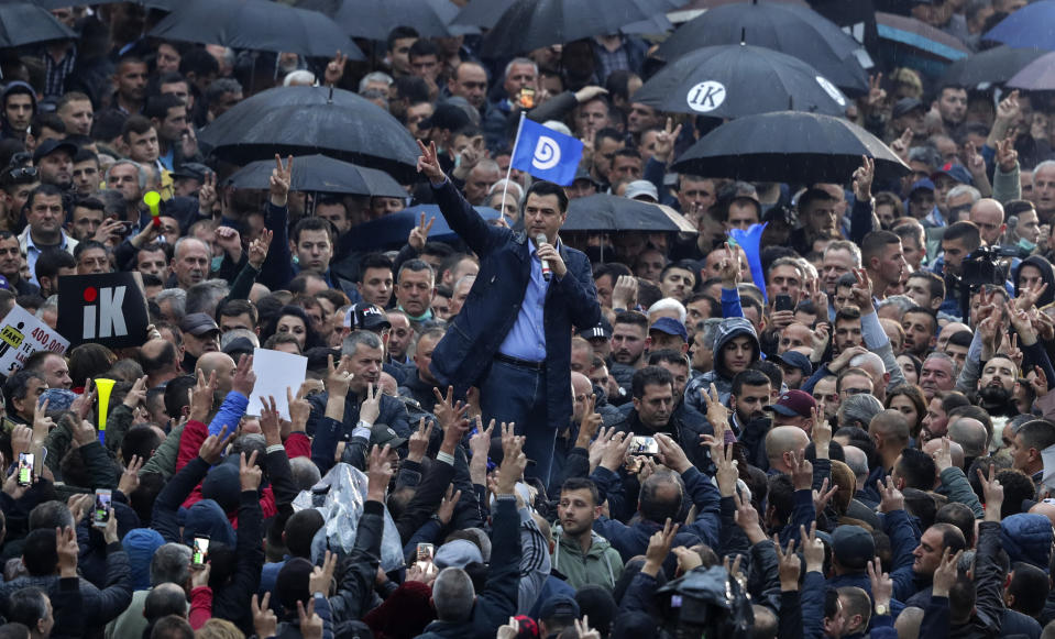 Albania's conservative opposition Democratic Party leader Lulzim Basha, delivers a speech during an anti-government rally in Tirana, Albania, Saturday, April 13, 2019. Albanian opposition parties have returned to the streets for the first time since mid-February calling for the government's resignation and an early election, as the center-right opposition accuses the leftist Socialist Party government of Prime Minister Edi Rama of corruption and links to organized crime, which the government denies. (AP Photo/Hektor Pustina)