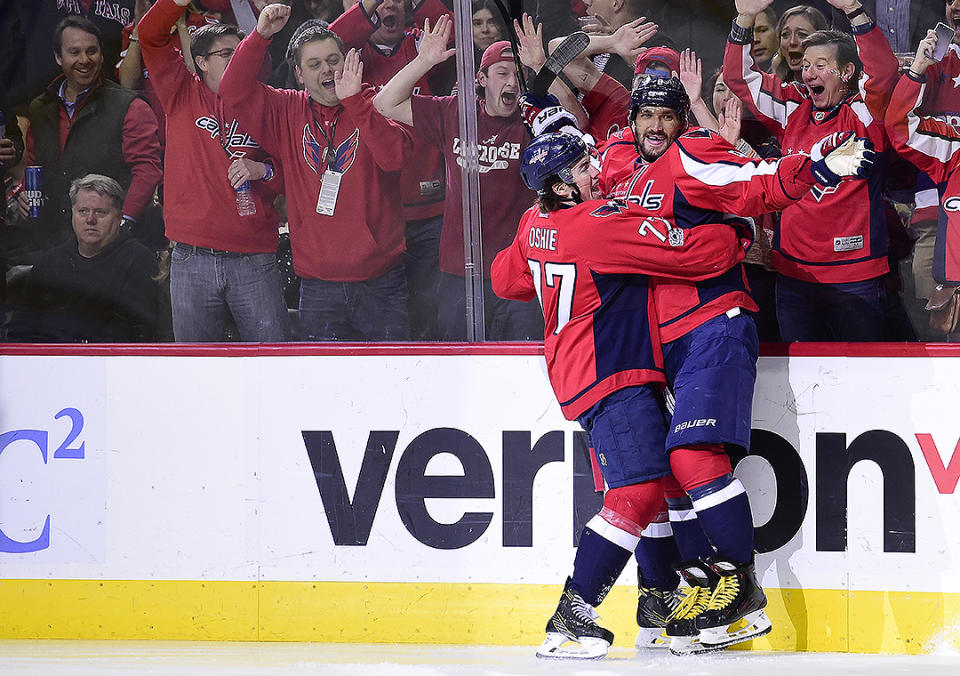 <p>Alex Ovechkin of the Washington Capitals celebrates with T.J. Oshie after scoring his 545th career goal - to pass NHL legend Maurice Richard for 29th place all-time — for his 1,000th career point against the Pittsburgh Penguins in the first period during an NHL game at Verizon Center on January 11, 2017, in Washington, DC. (Getty Images) </p>