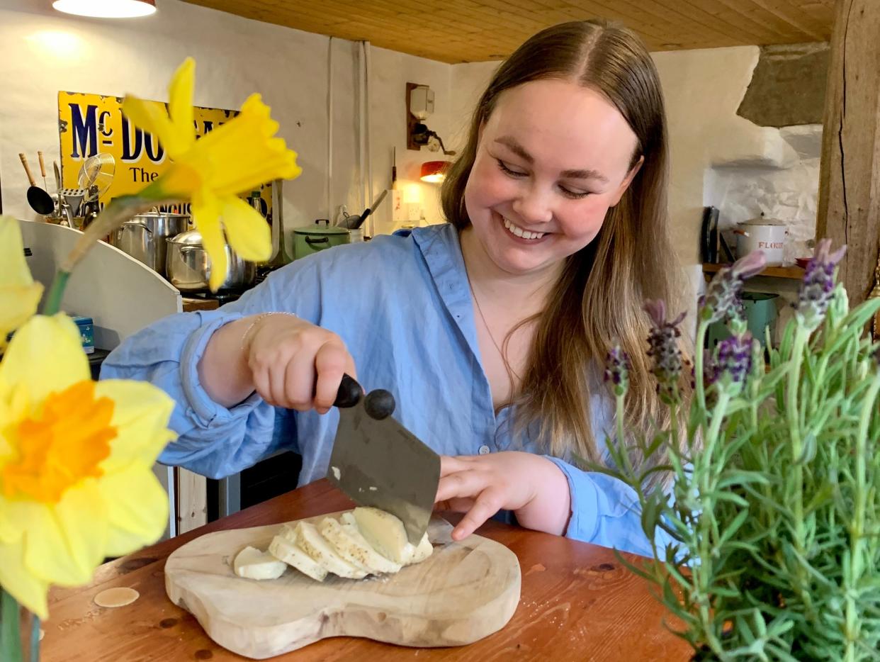 Freelancer George Arkley chopping up cheese.