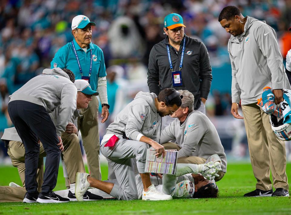 Miami Dolphins head coach Mike McDaniel talks to Miami Dolphins linebacker Cameron Goode (53), after he suffered an injuring agains the Buffalo Bills during NFL football game Jan 07, 2024, in Miami Gardens.