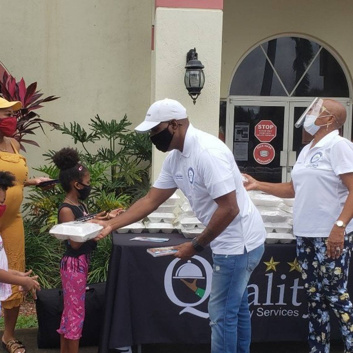 Steve Gallon, vice chair of the Miami-Dade School Board, gives out food as part of a community food drive. The School Board partnered with the Miami Dolphins Foundation, the City of Opa-locka, the Opa-locka Community Development Corp., and Quality Culinary Services to host a COVID-19 Food Relief Drive that served hot meals to more than 500 families.