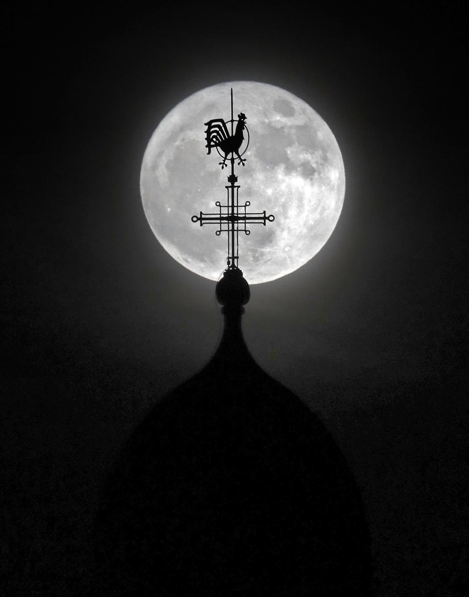 The Dormition Abbey is seen against a "supermoon"&nbsp;over the city of Jerusalem on Monday.