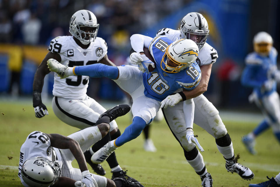 Los Angeles Chargers wide receiver Andre Patton is tackled by Oakland Raiders inside linebacker Will Compton during the first half of an NFL football game Sunday, Dec. 22, 2019, in Carson, Calif. (AP Photo/Kelvin Kuo)