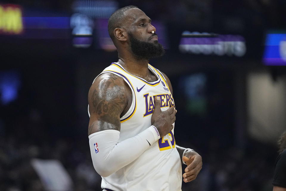 Los Angeles Lakers forward LeBron James (23) returns during the first half of the team's NBA basketball game against the Cleveland Cavaliers, Saturday, Nov. 25, 2023, in Cleveland. (AP Photo/Sue Ogrocki)