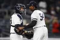 Apr 1, 2019; Bronx, NY, USA; New York Yankees relief pitcher Aroldis Chapman (54) and New York Yankees catcher Gary Sanchez (24) celebrate after defeating the Detroit Tigers at Yankee Stadium. Mandatory Credit: Adam Hunger-USA TODAY Sports