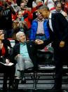 U.S. President Barack Obama (R) greets fans as he attends an NBA opening night game between the Cleveland Cavaliers and the Chicago Bulls in Chicago October 27, 2015. Earlier Tuesday Obama delivered remarks at an International Association of Chiefs of Police (IACP) conference and attended Democratic Party events in Chicago. REUTERS/Jonathan Ernst