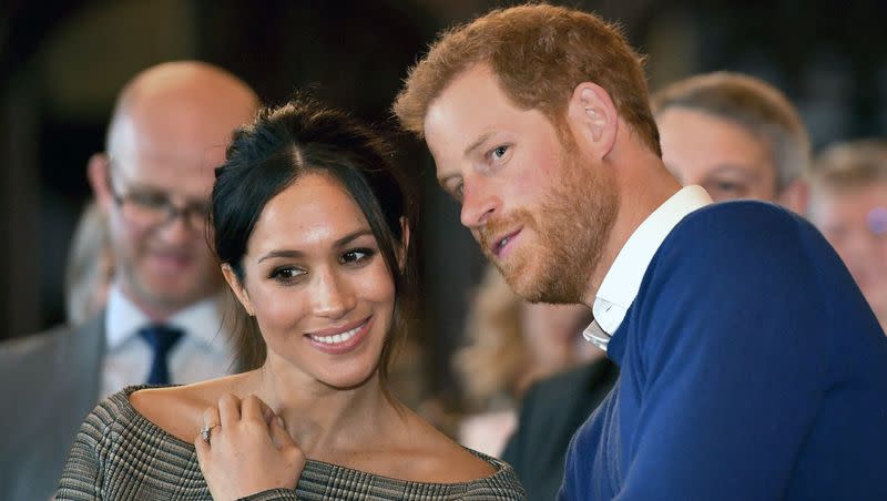 Prince Harry talks to Meghan Markle as they watch a dance performance by Jukebox Collective in the banqueting hall during a visit to Cardiff Castle, Wales. Oprah Winfrey recently shared her thoughts on whether Prince Harry and Meghan Markle should attend King Charles III’s coronation. 