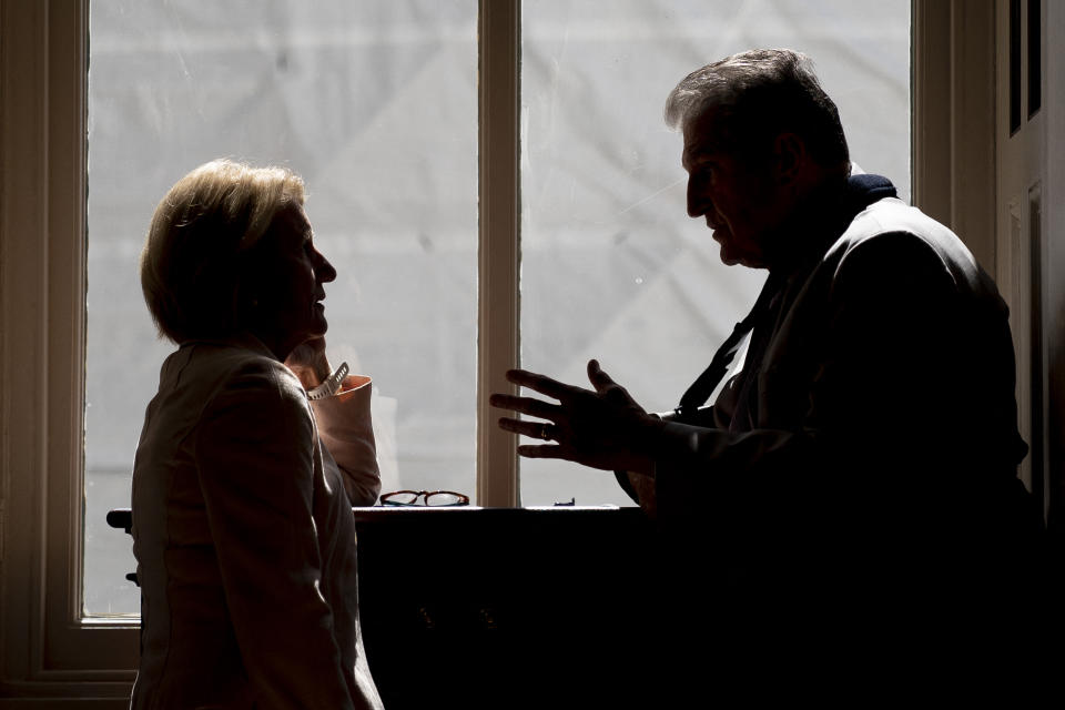 US Senator Joe Manchin (R) speaks to US Senator Shelley Moore Capito at the US Capitol in Washington, DC, on September 14, 2022. (Photo by Stefani Reynolds / AFP) (Photo by STEFANI REYNOLDS/AFP via Getty Images)