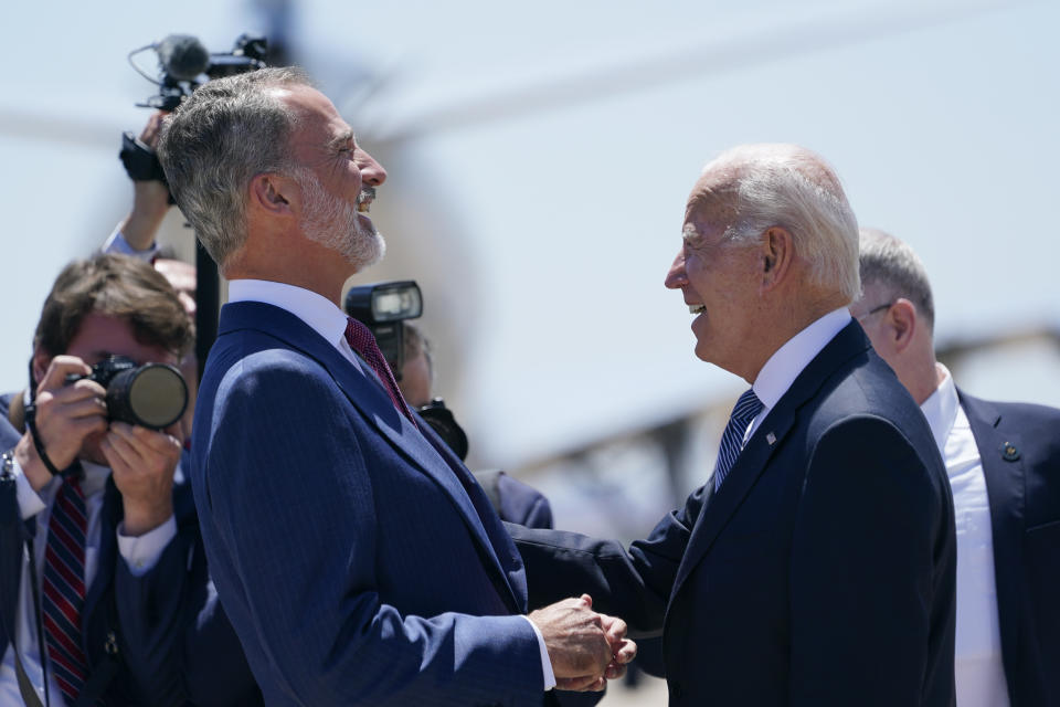 President Joe Biden is greeted by Spain's King Felipe VI as he arrives at Madrid's Torrejon Airport, Tuesday, June 28, 2022. Biden is in Spain to attend the North Atlantic Treaty Organization summit. (AP Photo/Susan Walsh)