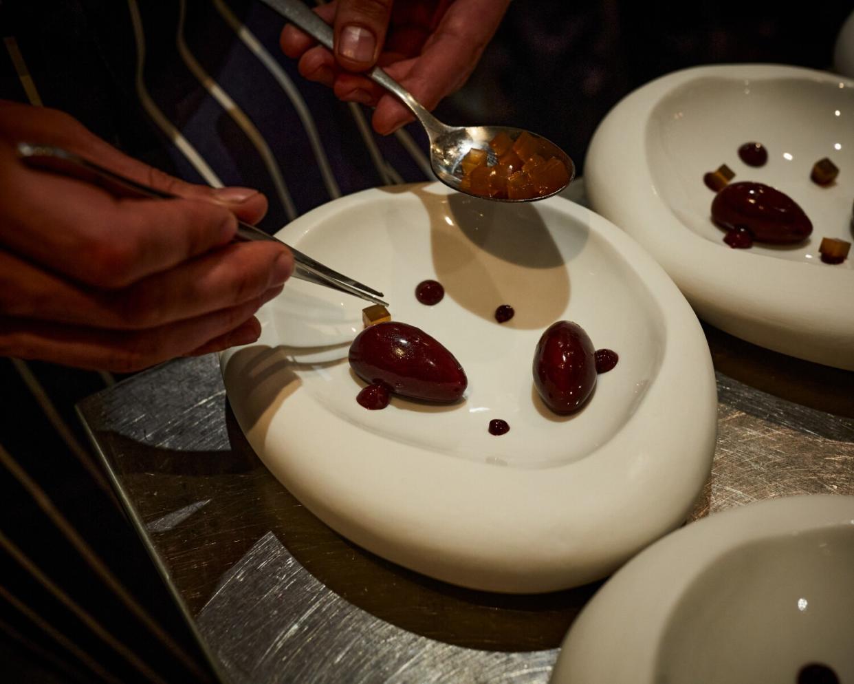 Cooks meticulously prepare foie gras at SOLA.