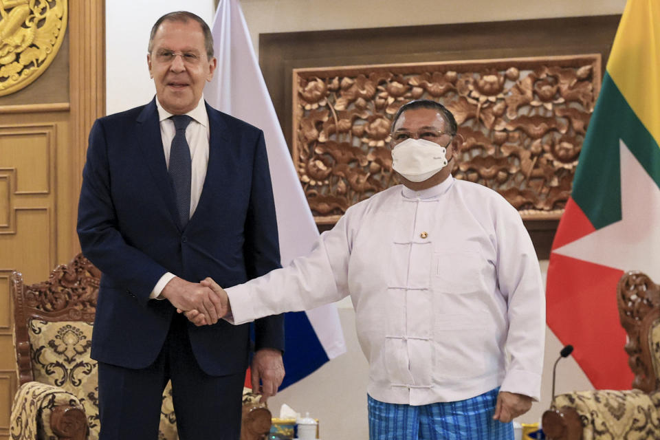 In this handout photo released by the Russian Foreign Ministry Press Service, Myanmar Foreign Minister Wunna Maung Lwin, right, and Russian Foreign Minister Sergey Lavrov shake hands as they pose for a photo prior to their talks in Naypyitaw, Myanmar, Wednesday, Aug. 3, 2022. (Russian Foreign Ministry Press Service via AP)
