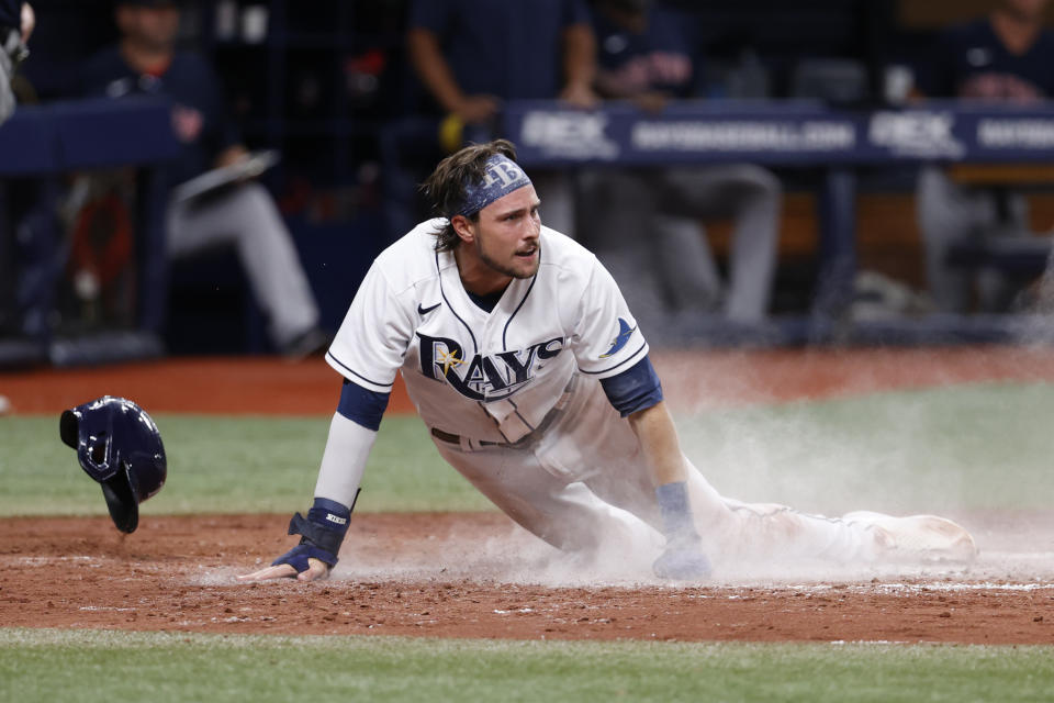 Tampa Bay Rays' Josh Lowe scores against the Boston Red Sox during the seventh inning of a baseball game Wednesday, July 13, 2022, in St. Petersburg, Fla. (AP Photo/Scott Audette)