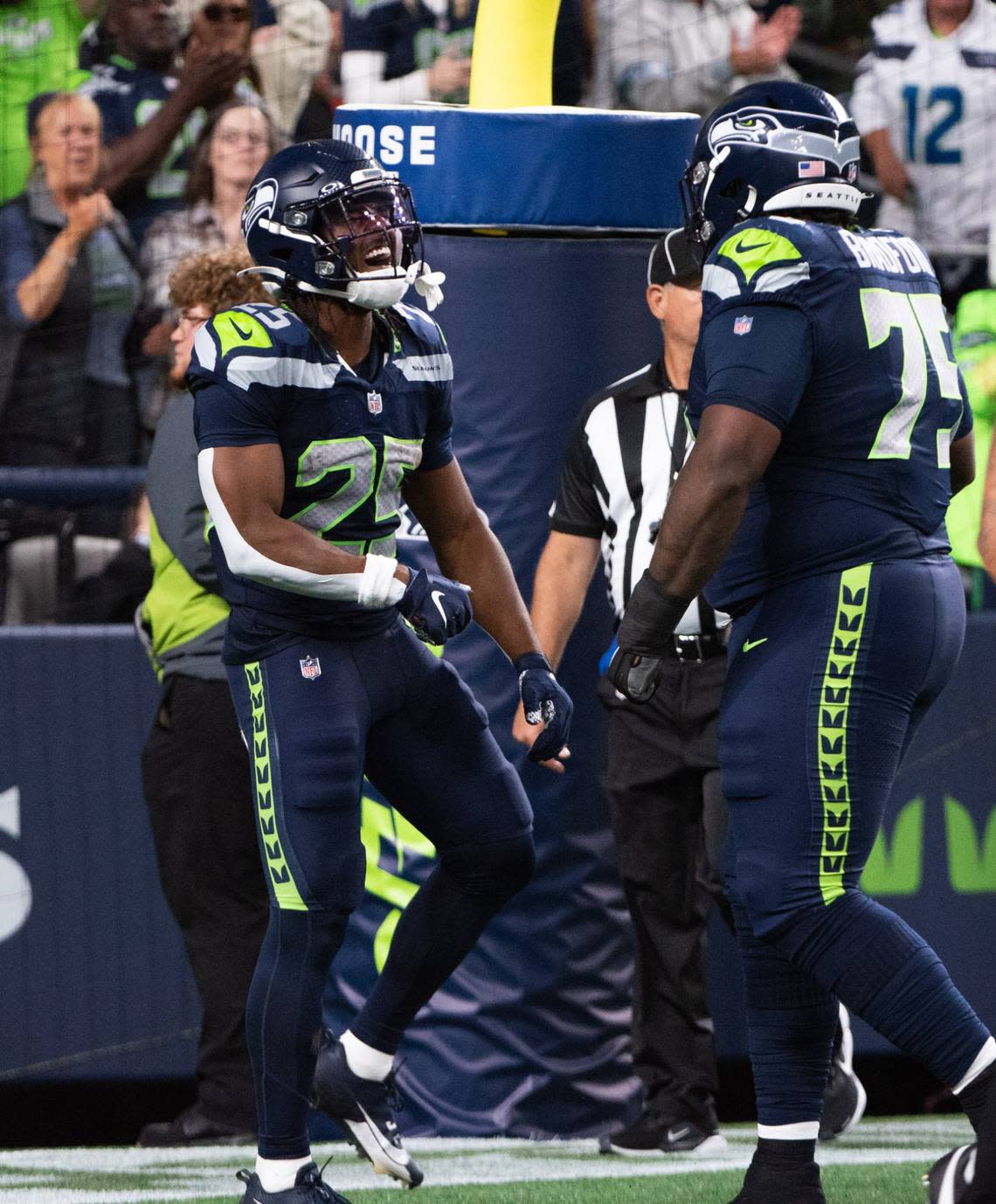 Seahawks running back Kenny McIntosh (25) screams after scoring a touchdown against the Cleveland Browns in the first quarter of an NFL preseason game at Lumen Field in Seattle Saturday, Aug. 24, 2024.