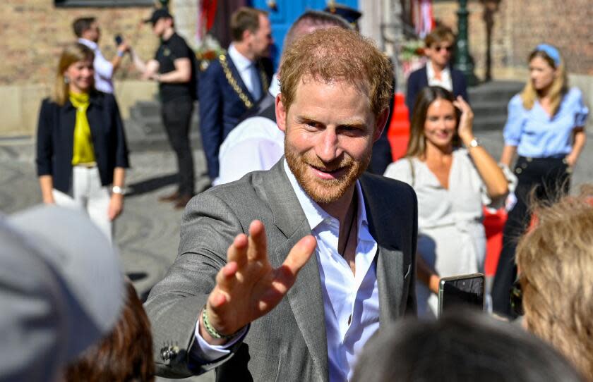 Prince Harry, Duke of Sussex, talks with wellwishers as he leaves the city hall in Duesseldorf, western Germany, where he was received on September 6, 2022 in the context of the "One Year to Go" event of the Invictus Games Duesseldorf 2023. The Duke of Sussex is the founder and patron of the Invictus Games Foundation. - The Duke of Sussex is the founder and patron of the Invictus Games Foundation. The 2023 edition of the Invictus Games, an international multi-sport event for wounded, injured and sick servicemen and women, both serving and veterans, will take place from September 9 to 16, 2023. (Photo by Sascha Schuermann / AFP) (Photo by SASCHA SCHUERMANN/AFP via Getty Images)