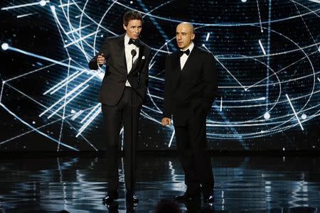 Actor Eddie Redmayne (L) and entrepreneur Yuri Milner introduce the recipients of the fundamental physics prize during the 2nd annual Breakthrough Prize Award in Mountain View, California November 9, 2014. REUTERS/Stephen Lam