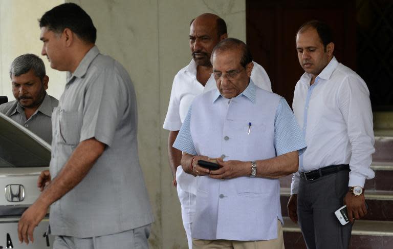 Vijay Kumar Malhotra (C), Indian Olympic Association member, leaves a hotel after a meeting in New Delhi on April 27, 2015