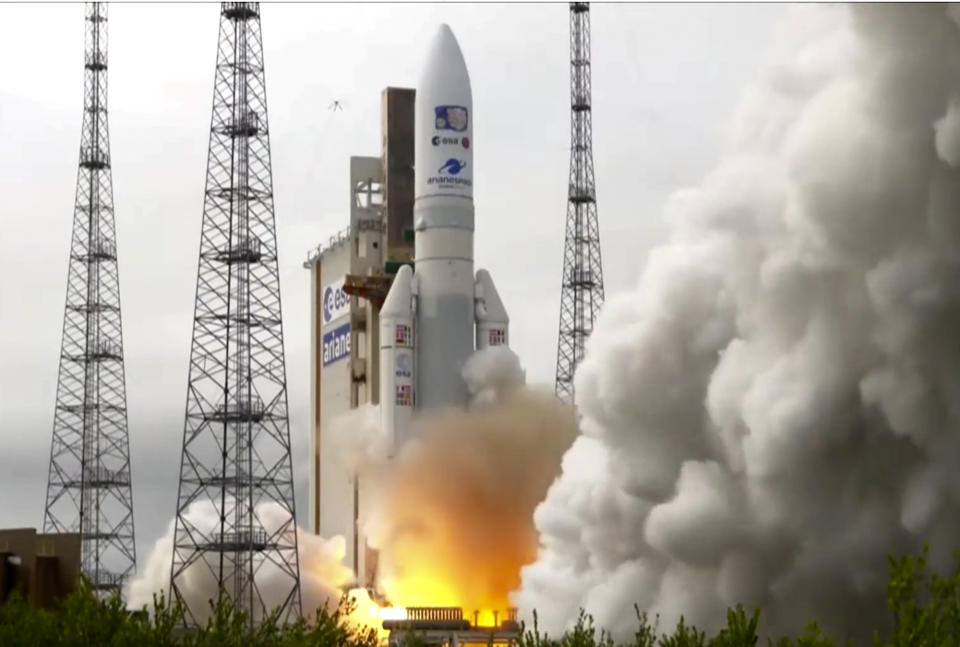 In this image provided by the European Space Agency, an Ariane rocket carrying the robotic explorer Juice takes off from Europe's Spaceport in French Guiana, Friday, April 14, 2023. European spacecraft has blasted off on a quest to explore Jupiter and three of its ice-encrusted moons. Dubbed Juice, the robotic explorer set off on an eight-year journey Friday from French Guiana in South America, launching atop an Ariane rocket. (ESA via AP)